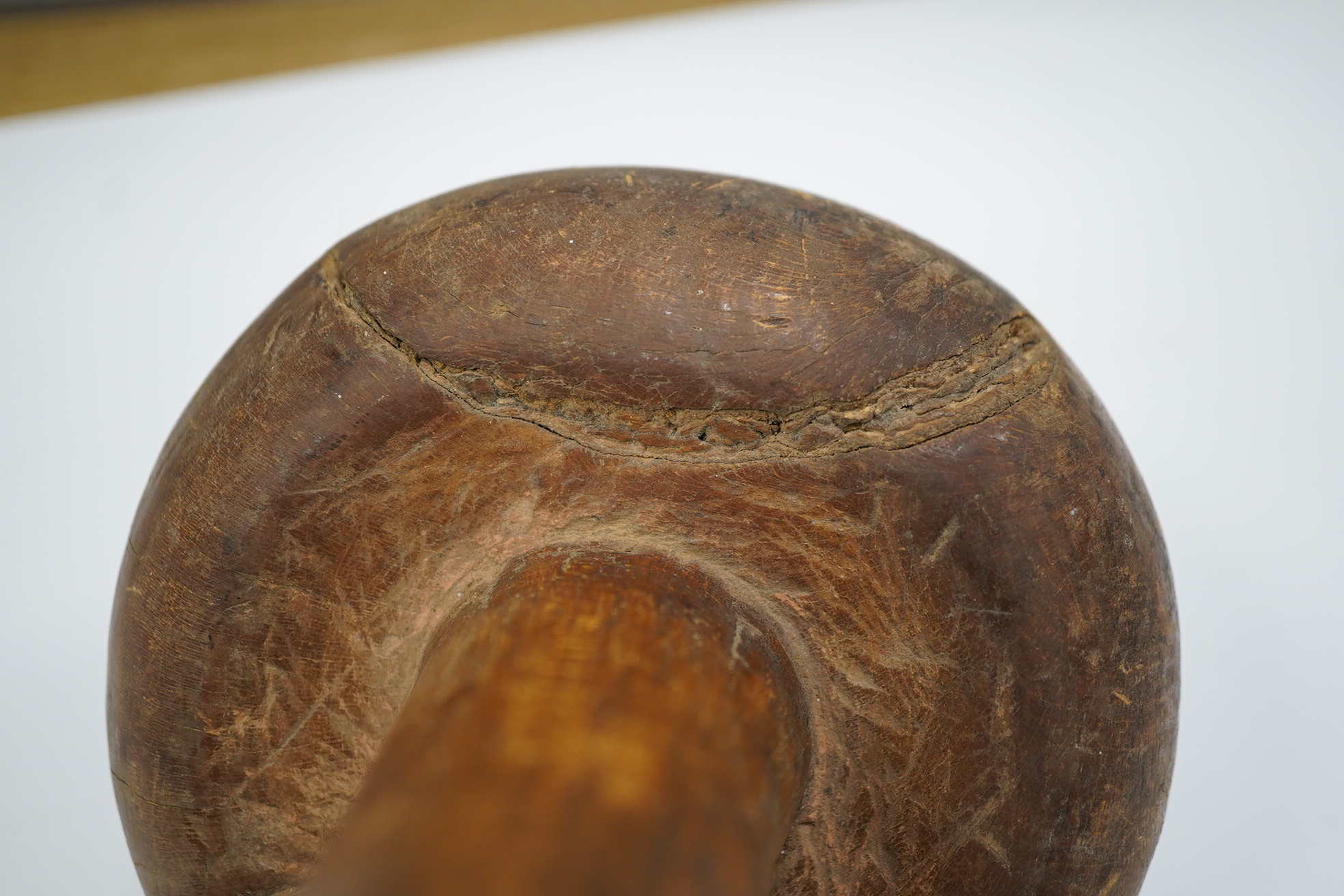 A Sudanese wooden Knobkerrie, approximately 62cm long, with profoundly swollen mushroom shaped head. Condition - poor to fair